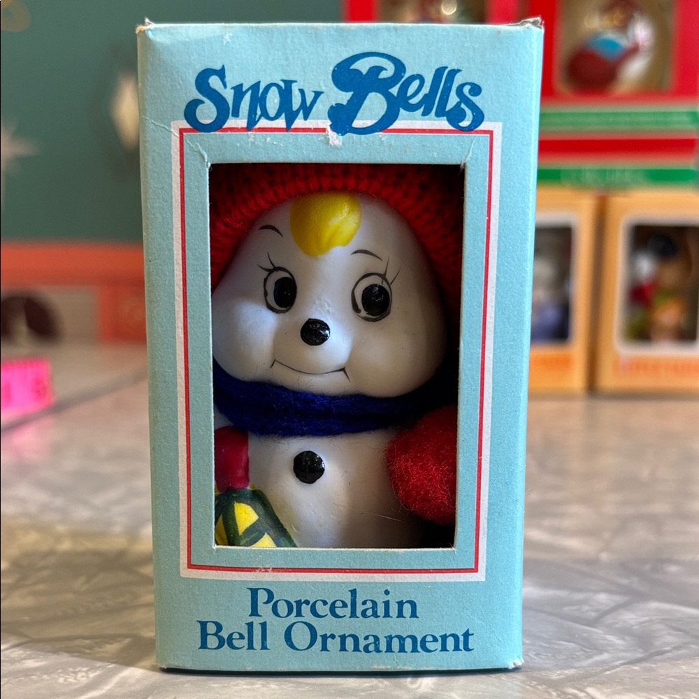 New in Box Porcelain Snow Bell Ornament - Red and Blue